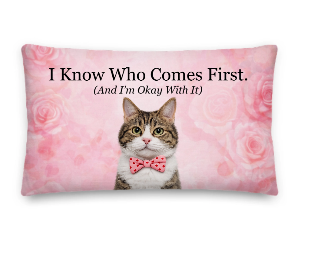 Pillow with a cat wearing a bow tie and pink roses on a pink background with text.