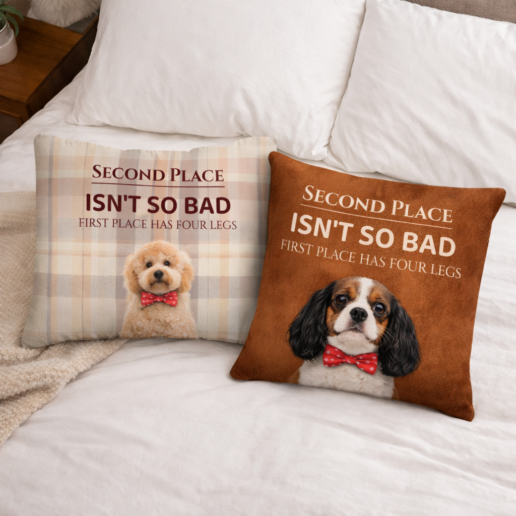 Two decorative pillows with dog illustrations and humorous text on a bed.