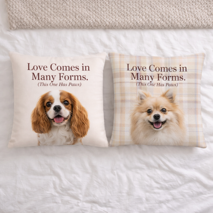 Two pillows with dog illustrations and text 'Love Comes in Many Forms. (This One Has Paws)' on a bed.