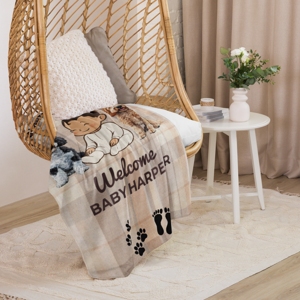 Baby blanket with personalized text on a chair in a cozy room