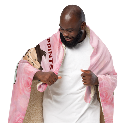 Man holding a pink blanket with cartoon character and text on a white background