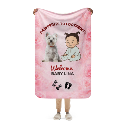Person holding a pink baby blanket with a dog and baby illustration, text 'Pawprints to Footprints Welcome Baby Lina', and floral design.